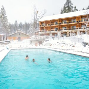 Snow swimming in the heated pool at Rush Creek Lodge Yosemite.